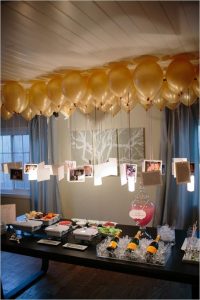 Photos floating below gold balloons