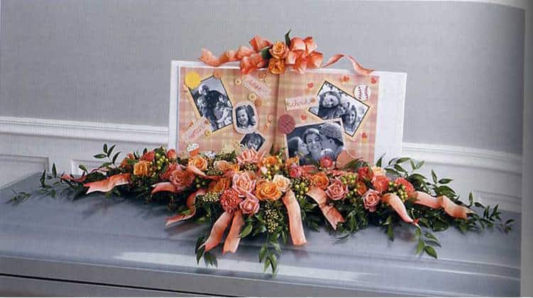 Casket flower arrangement with photos