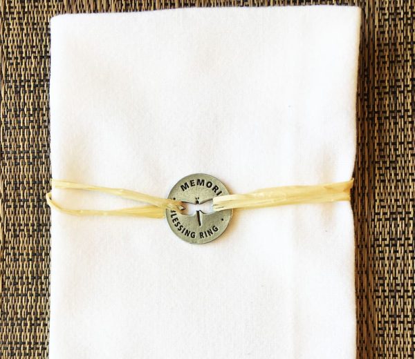 Using Dragonfly Memorial Coin as a napkin holder